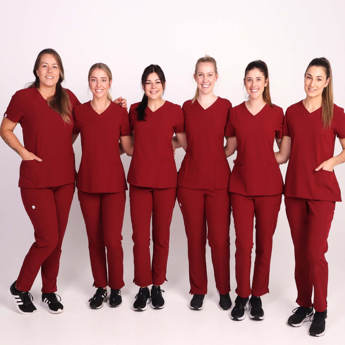 Nurse wearing Burgundy Medical Scrub Set by Fit Right Medical Scrubs. Available online near you today.