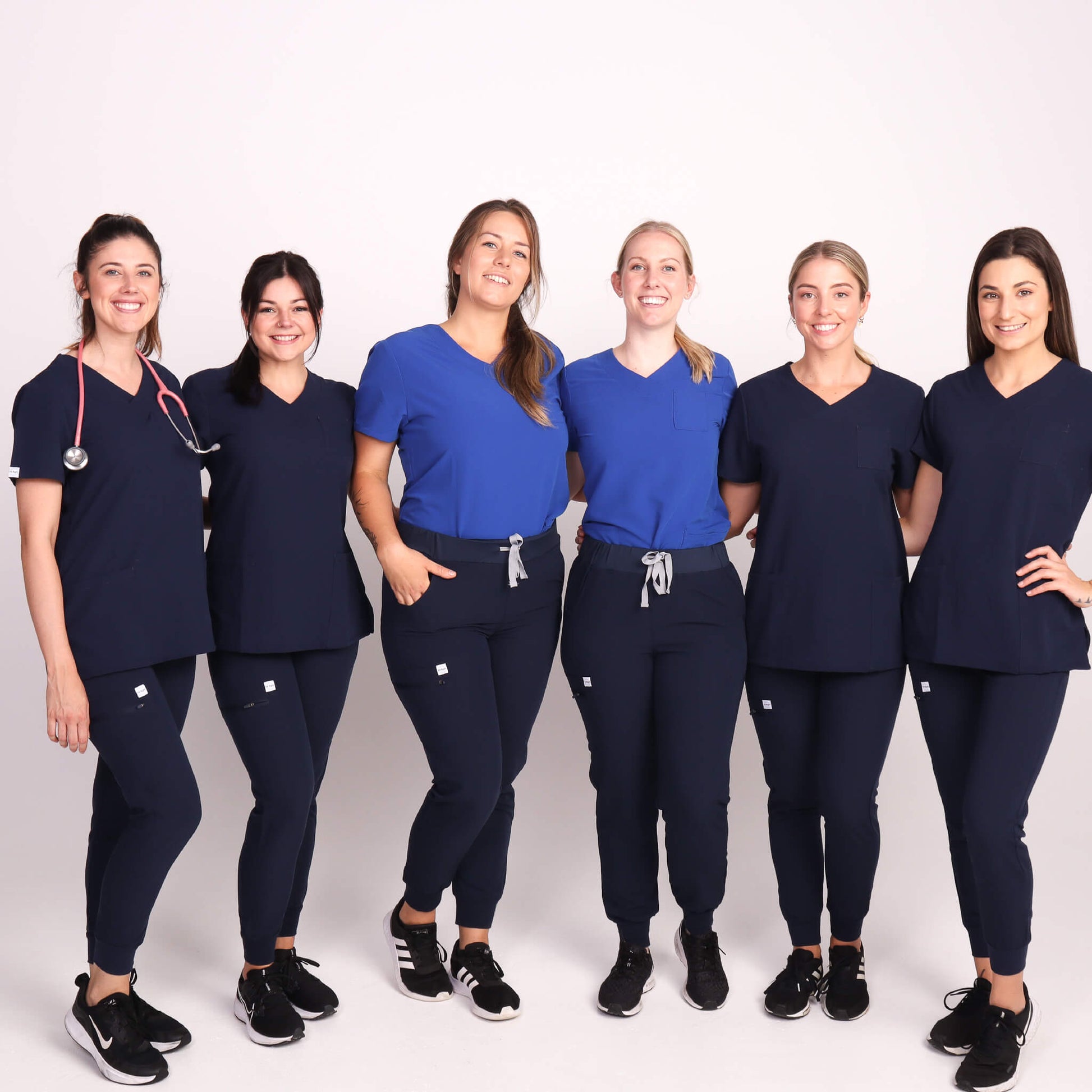 Nurses wearing Navy Medical Jogger Scrub Pants and Navy & Royal Blue Medical Scrub Top from Fit Right Medical Scrubs Australia