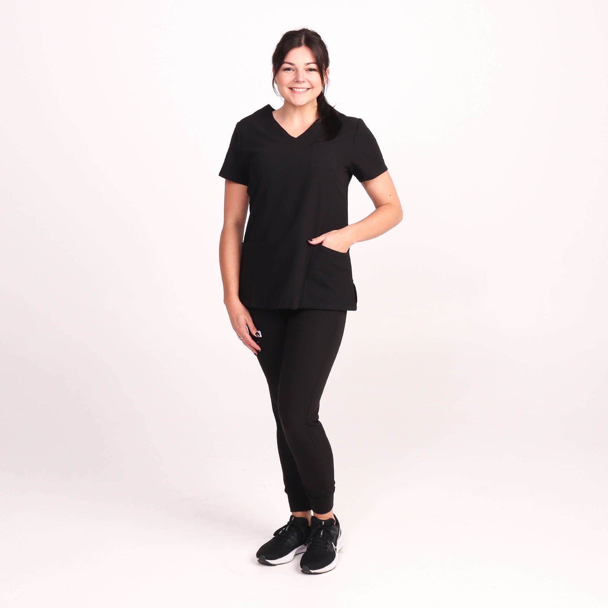 Nurse wearing Black Medical Scrub Jogger Pants and Black Medical Scrub Top from Fit Right Medical Scrubs Australia