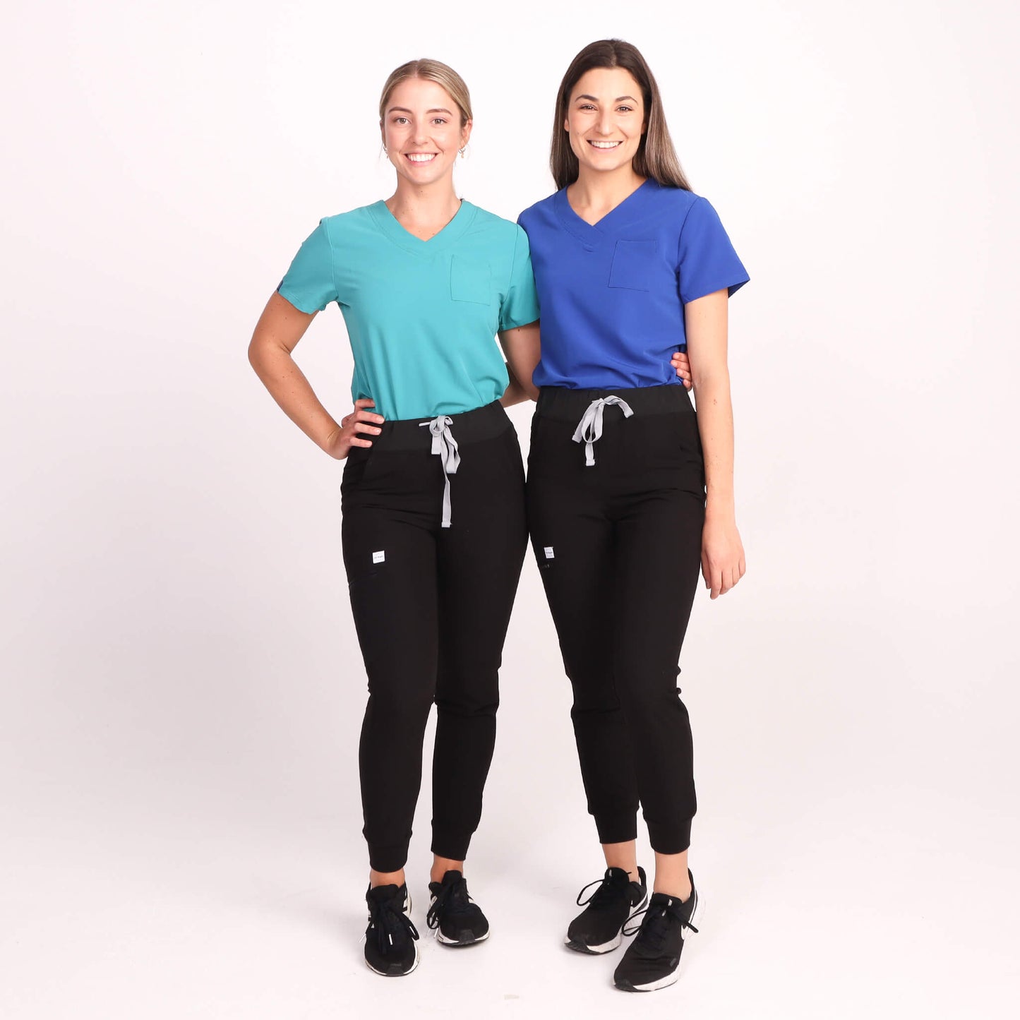 Nurse wearing Black Medical Scrub Jogger Pants and Teal & Royal Blue Medical Scrub Top from Fit Right Medical Scrubs Australia