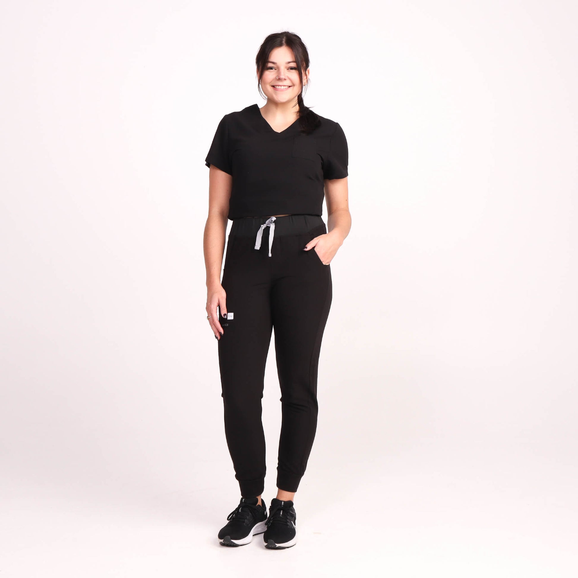 Nurse wearing Black Medical Scrub Jogger Pants and Black Medical Scrub Top from Fit Right Medical Scrubs Australia