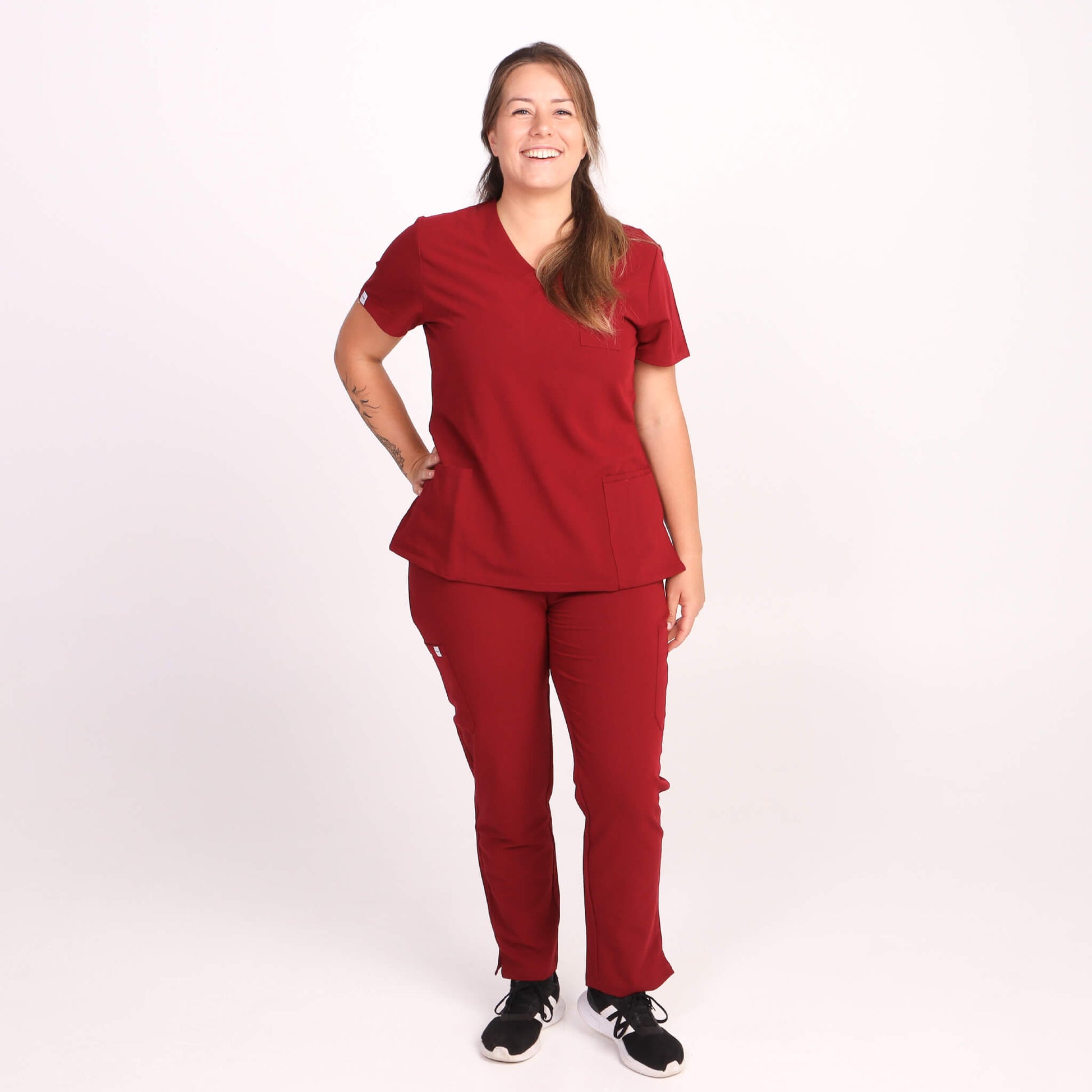 Nurse wearing Burgundy Medical Scrub Set by Fit Right Medical Scrubs. Available online near you today.