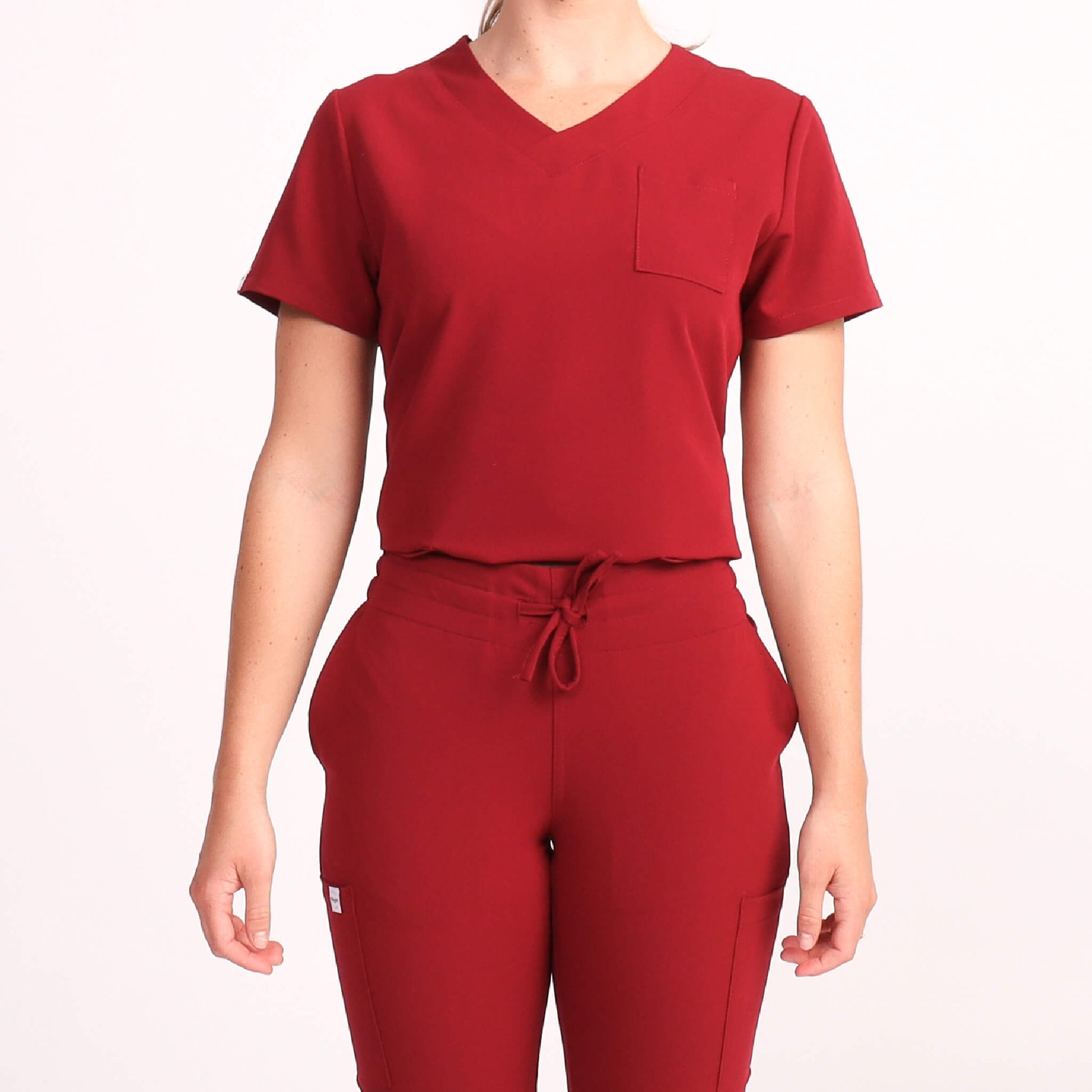 Nurse wearing Burgundy Medical Scrub Set by Fit Right Medical Scrubs. Available online near you today.