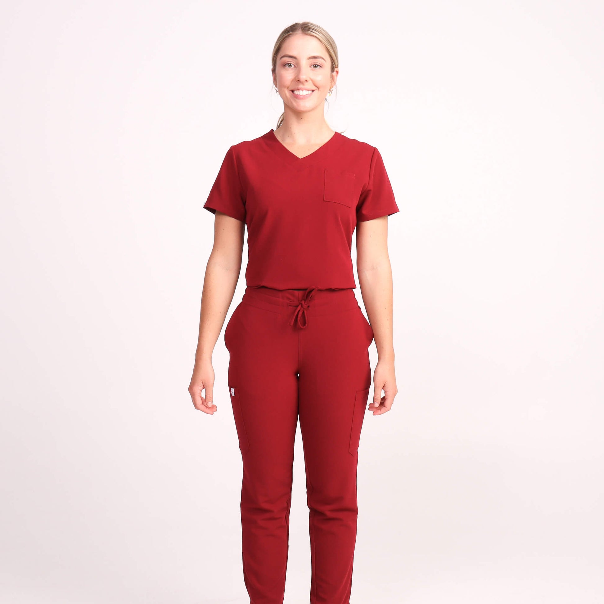 Nurse wearing Burgundy Medical Scrub Set by Fit Right Medical Scrubs. Available online near you today.