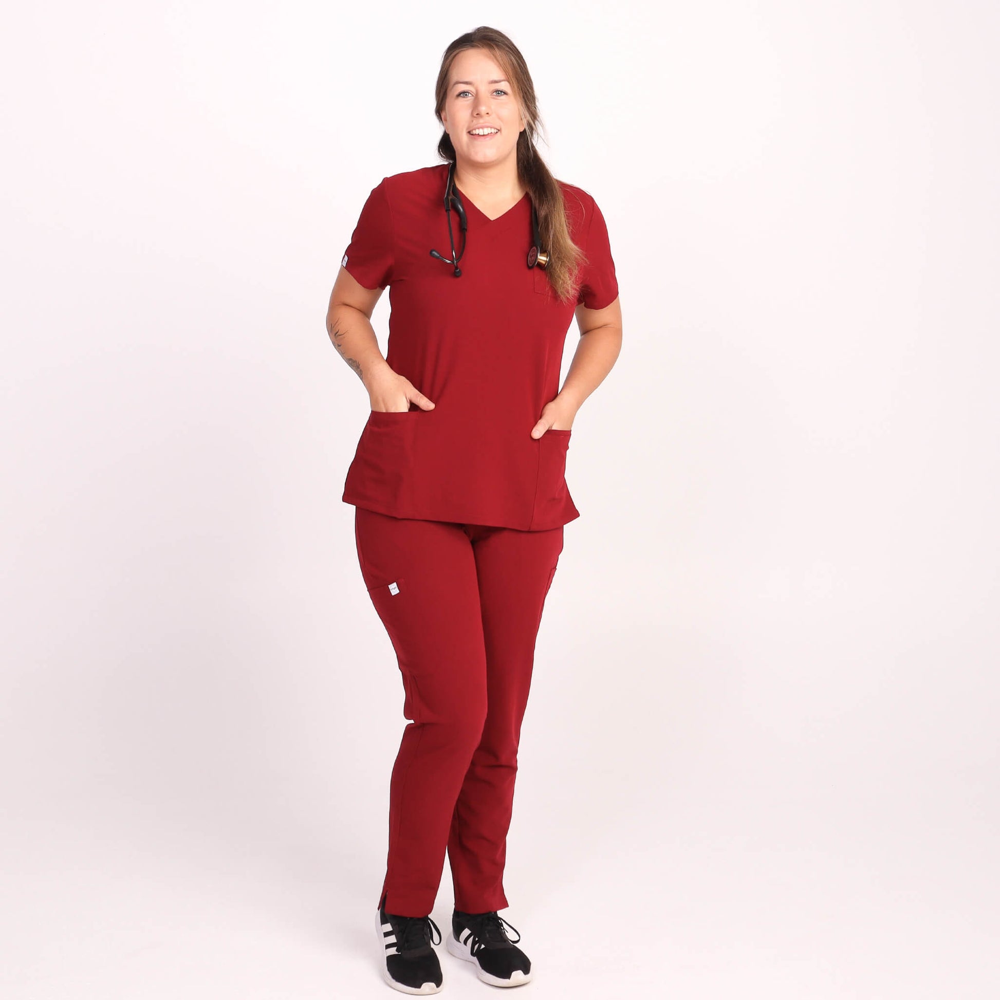 Nurse wearing Burgundy Medical Scrub Set by Fit Right Medical Scrubs. Available online near you today.