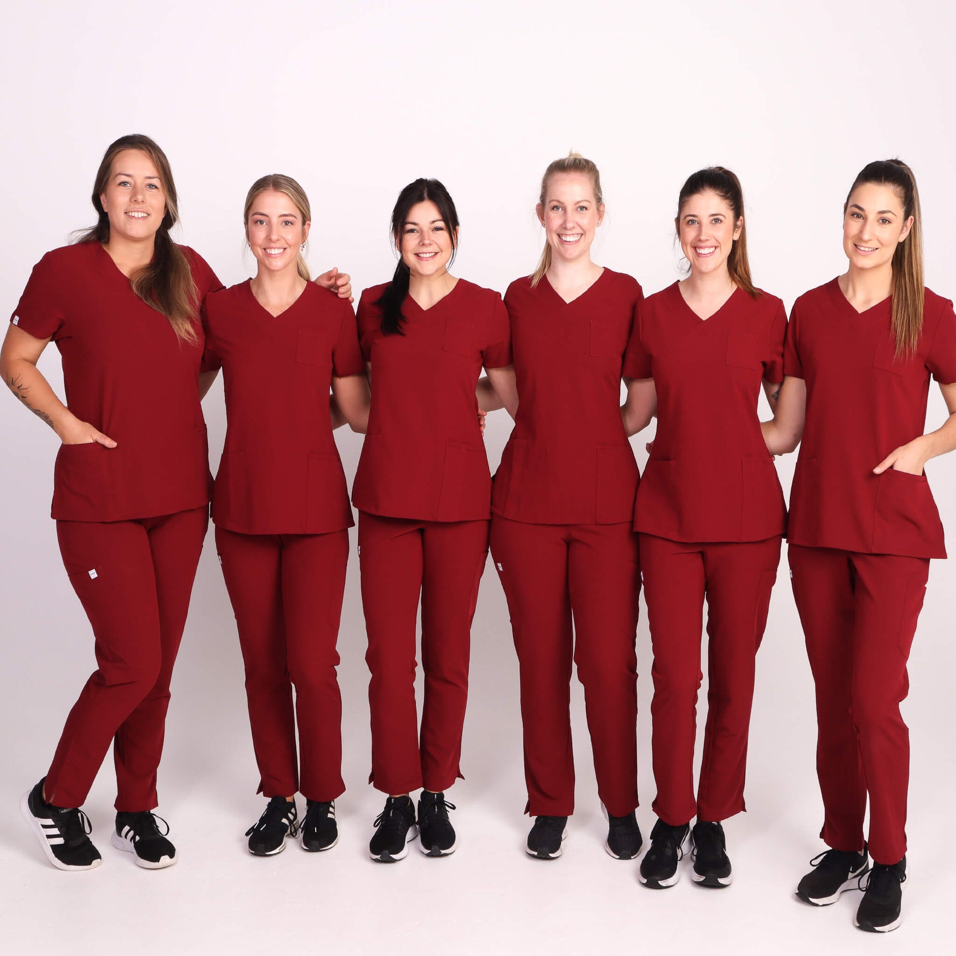 Nurse wearing Burgundy Medical Scrub Set by Fit Right Medical Scrubs. Available online near you today.
