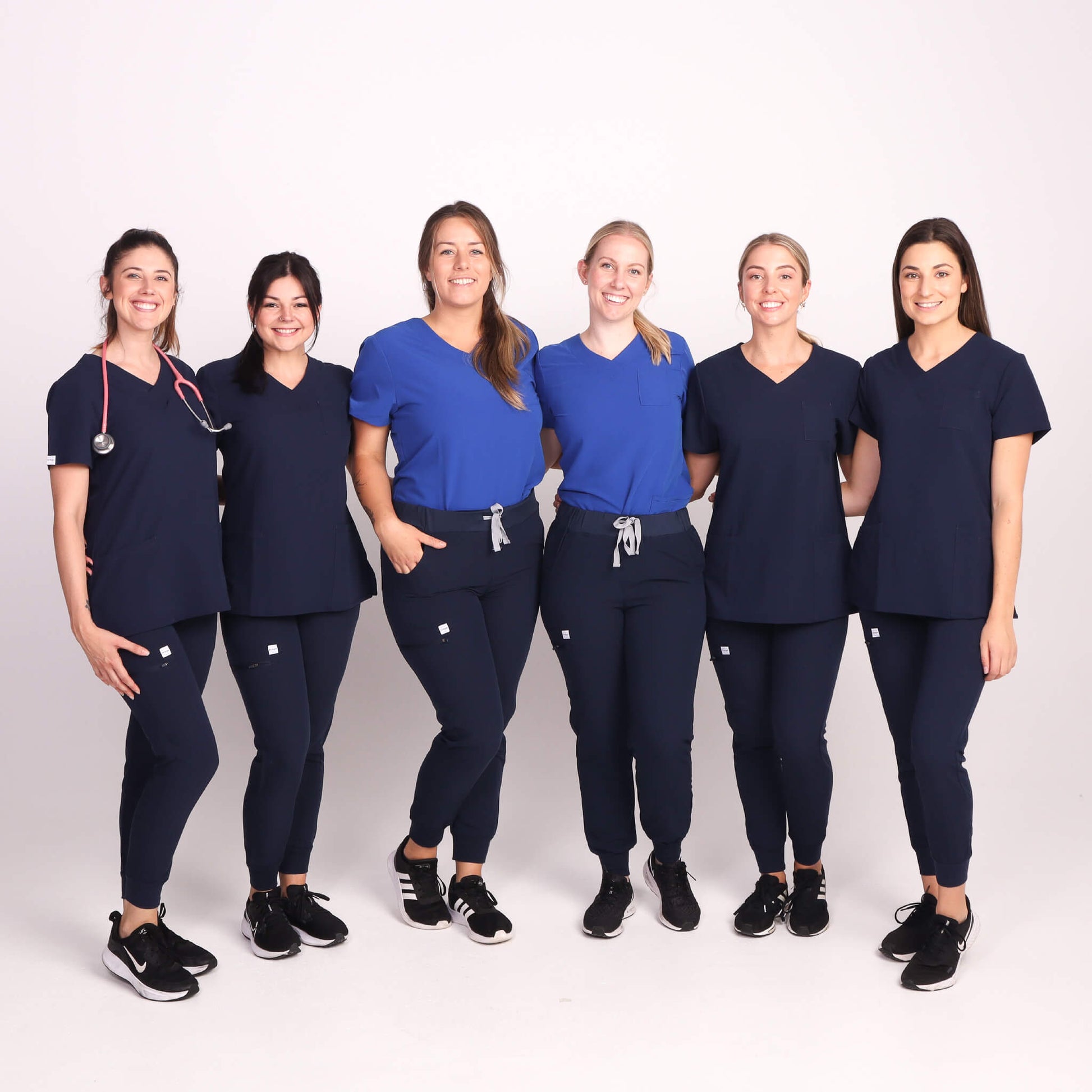 Nurses wearing Navy Medical Jogger Scrub Pants and Navy & Royal Blue Medical Scrub Top from Fit Right Medical Scrubs Australia