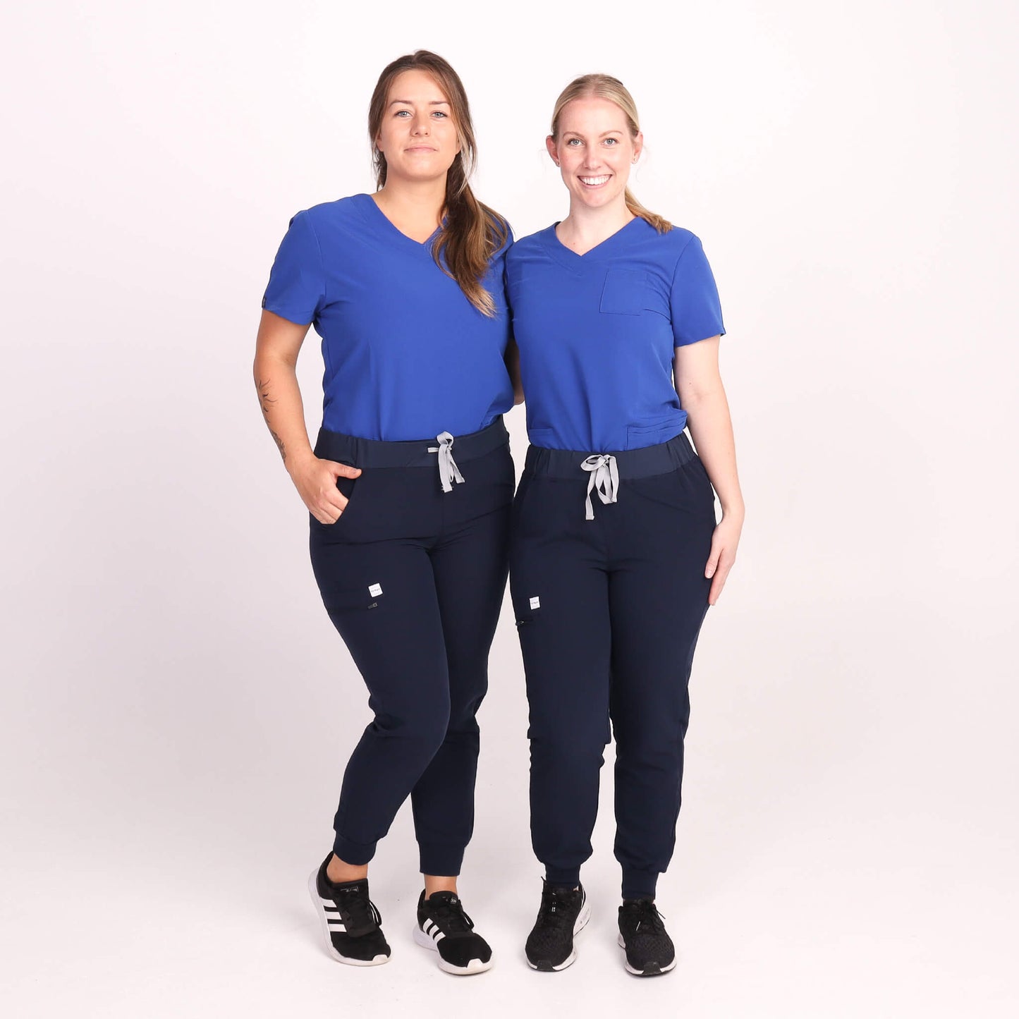 Nurses wearing Navy Medical Jogger Scrub Pants and Navy & Royal Blue Medical Scrub Top from Fit Right Medical Scrubs Australia