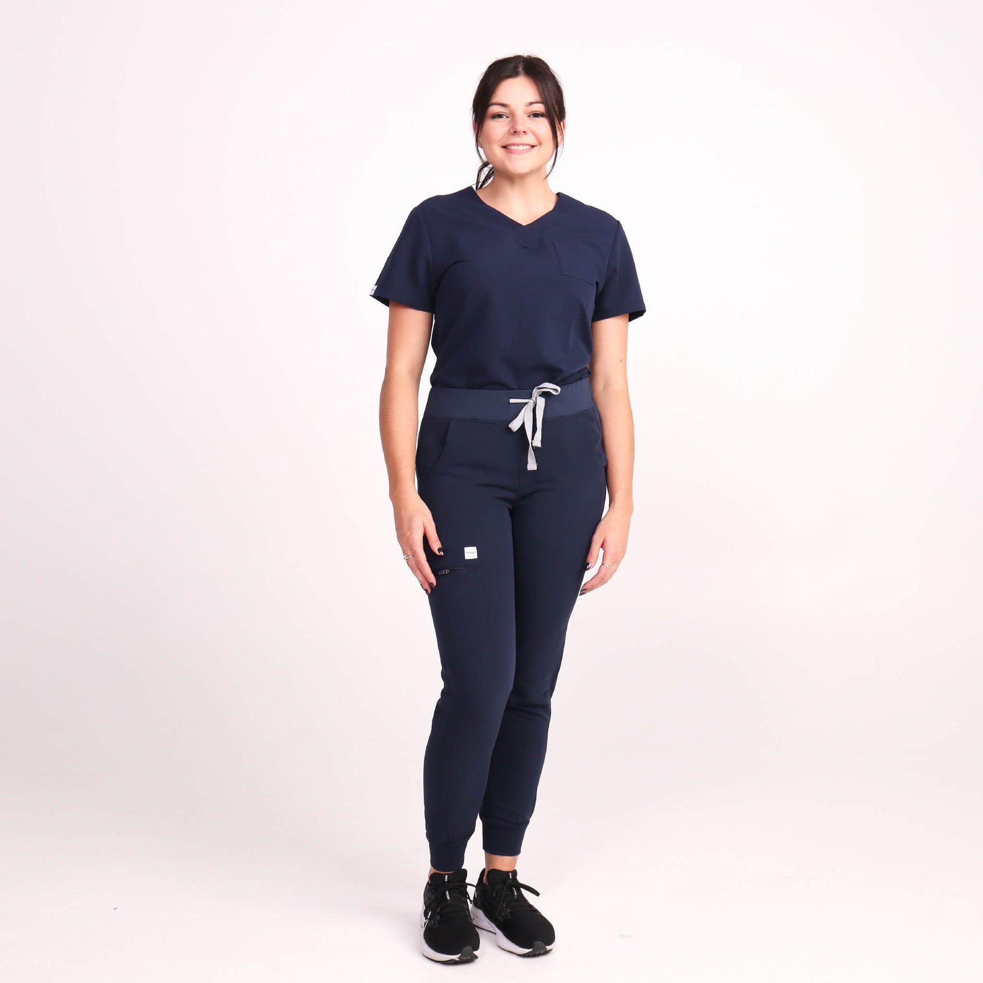 Nurse wearing Navy Medical Jogger Scrub Pants and Navy Medical Scrub Top from Fit Right Medical Scrubs Australia