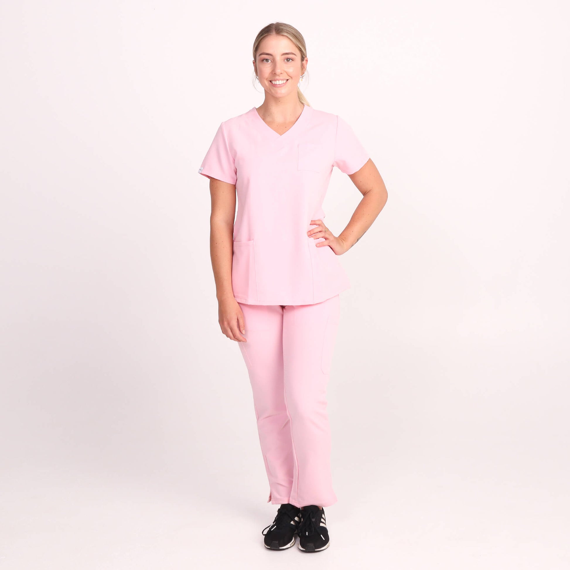 Nurse wearing Pink Medical Scrub Set from Fit Right Medical Scrubs