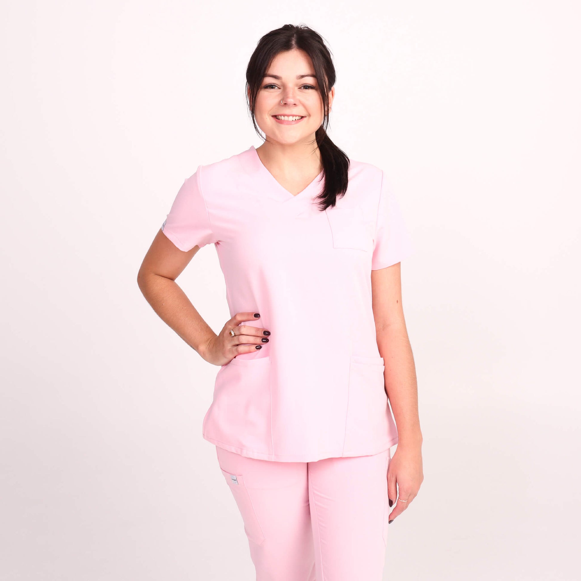 Nurse wearing Pink Medical Scrub Set from Fit Right Medical Scrubs